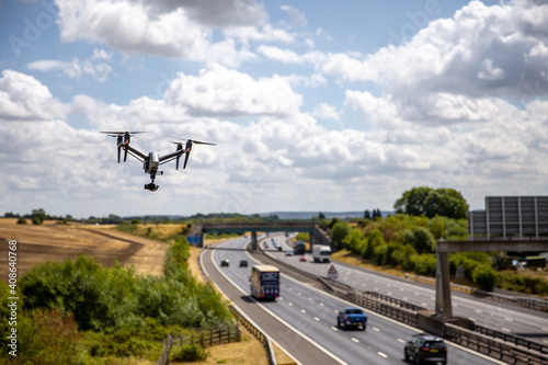 A Drone Surveying Close to a Highway © Stock87