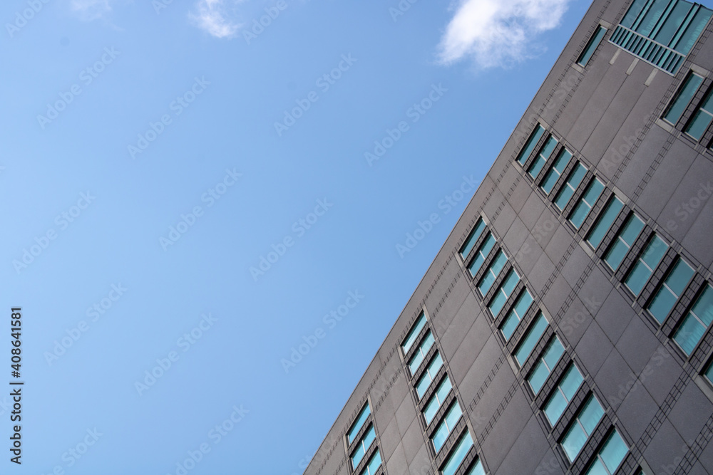 Skyscraper with concrete and glass with clear blue sky