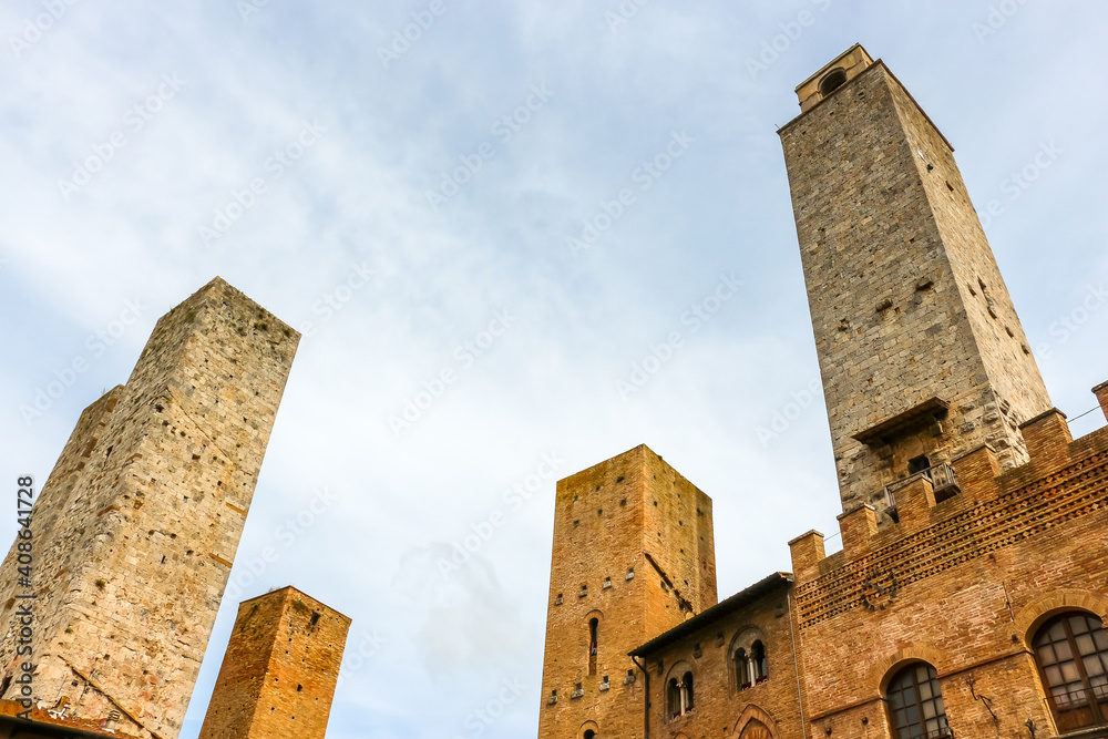 San Gimignano, Italy. View of medieval towers at the central square of San Gimignano.
