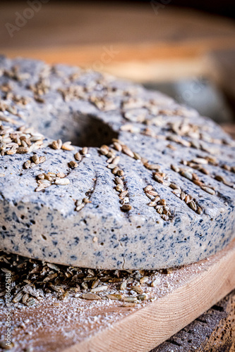 Device for the manufacture of flour of the old type, stone millstones on a wooden platform,