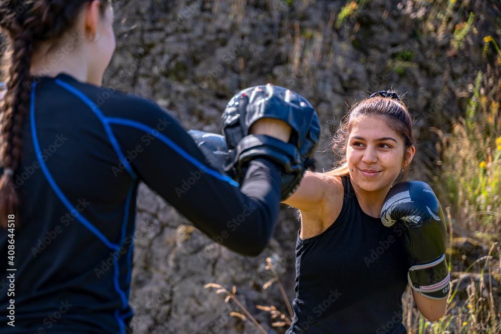 Pretty young girl practices boxing Pretty young girl practices boxing