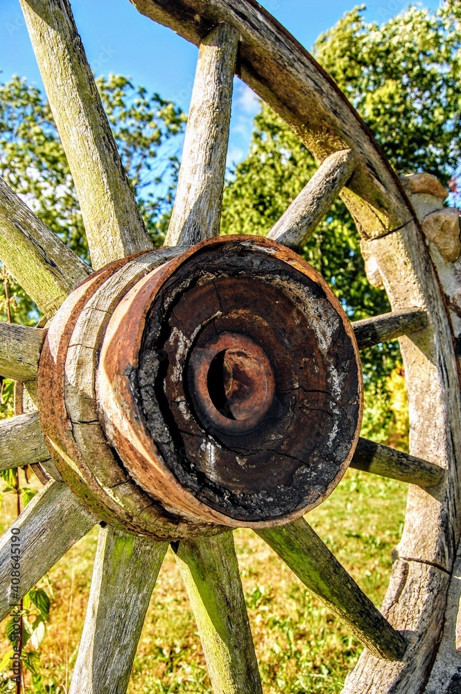 Old wheel for ladder wagon. Made of old wood technology Old wheel for ladder wagon. Made of old wood technology