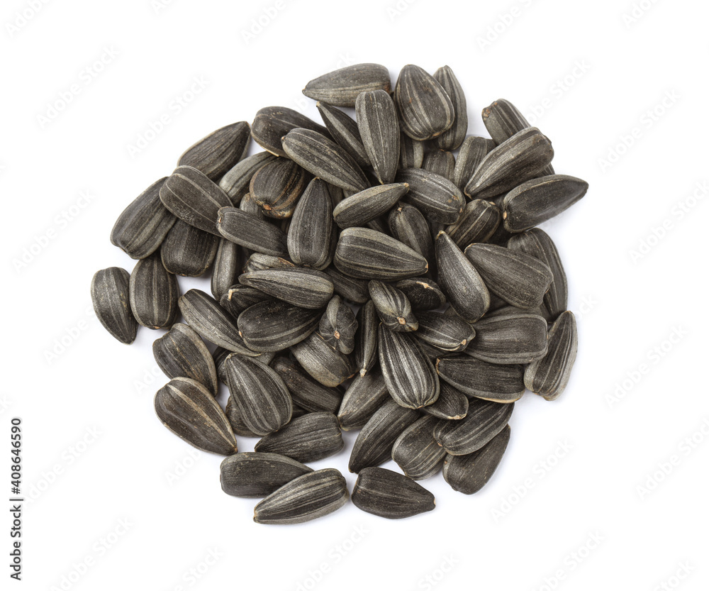 Raw sunflower seeds on white background, top view Raw sunflower seeds on white background, top view
