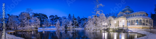 Cityscape of Madrid on a Snowy night at the Retiro Park