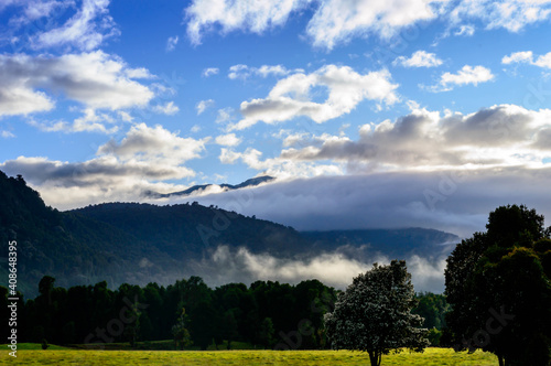 Morning landscape on a sunny mountain and valley day.