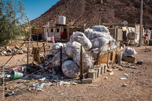 bags with different garbage in desert