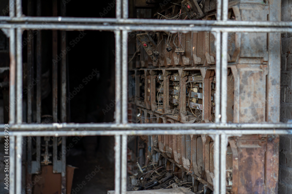 The interior of an old vacant building, damaged electrical appliances.