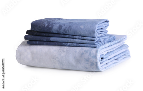 Stack of clean bed linen isolated on white