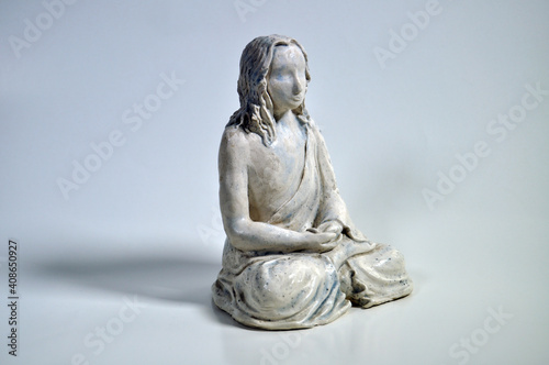 Figure of a meditator in white