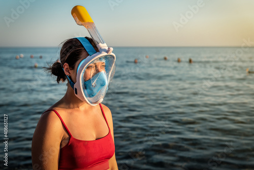 woman in full-face snorkeling mask