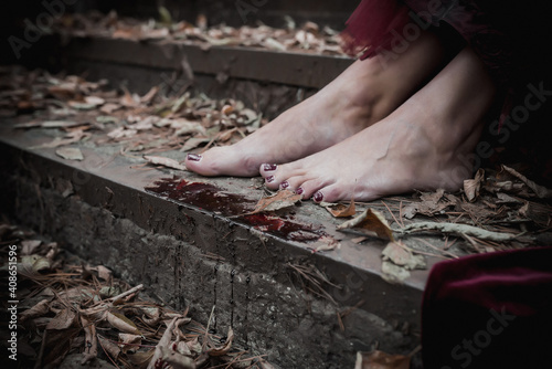 legs with witch blood in yellow foliage