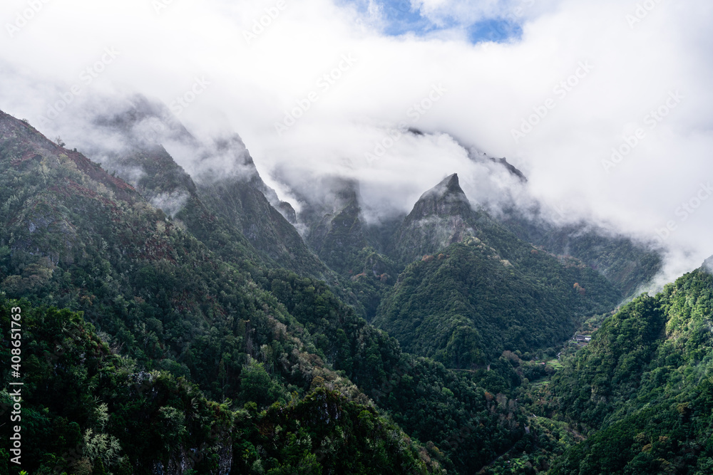 Green cloud-covered mountain peaks on Madeira Island Green cloud-covered mountain peaks on Madeira Island