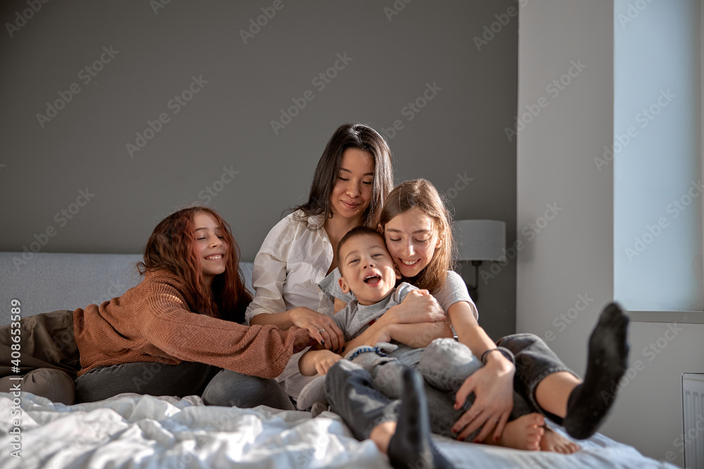 Cheerful happy family is having time at cozy home