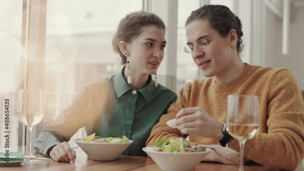 custom made wallpaper toronto digitalMedium shot of young Caucasian man having lunch in restaurant with his girlfriend and feeding her with piece of boiled egg from salad