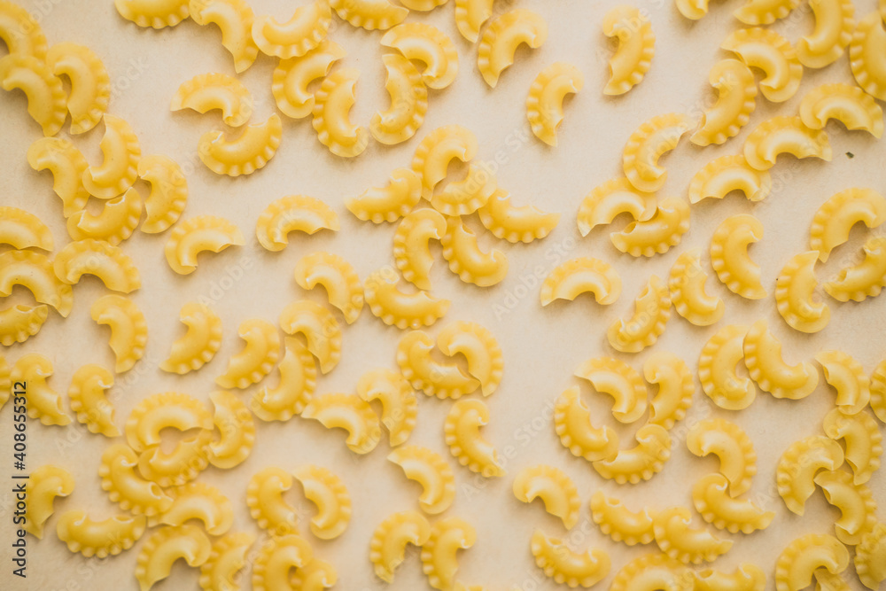 pasta on a beige background. Flat lay. copy space.