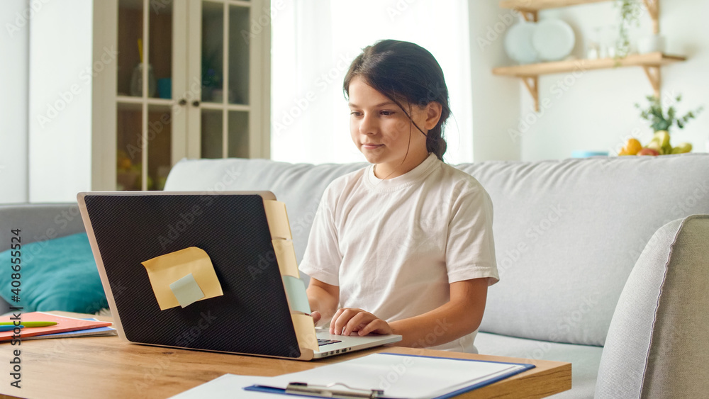 Schoolgirl Chatting on Webcam While Preparing for a Test or Exam with an Online Teacher. Schoolgirl Chatting on Webcam While Preparing for a Test or Exam with an Online Teacher.