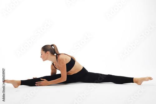 Yoga and sport concept - Beautiful young woman doing yoga, isolated on white background photo