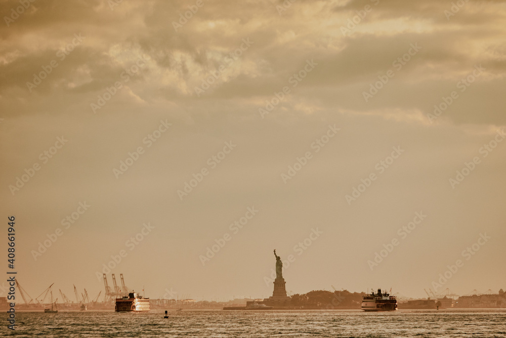 Stormy sunset over statue of liberty skyline. Stormy sunset over statue of liberty skyline.