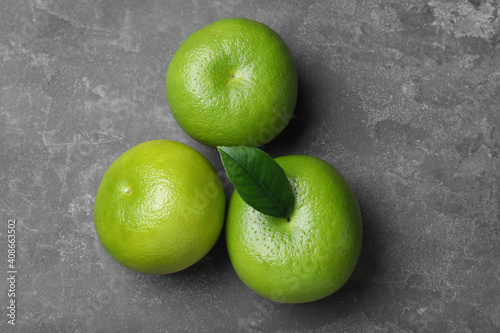 Fototapeta Naklejka Na Ścianę i Meble -  Fresh ripe sweeties on grey table, flat lay