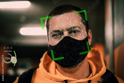 Man with face mask on face recognition software facial mask
