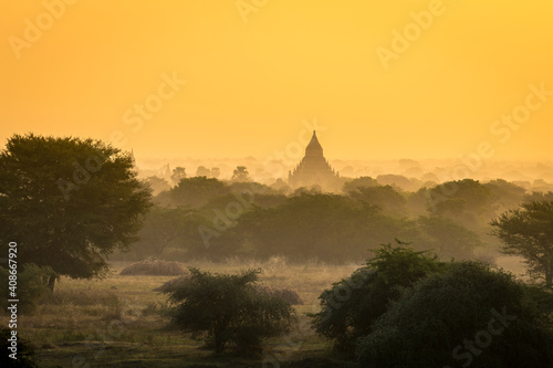 Pagoda against clear orange sky during sunrise, UNESCO, Bagan, Myanmar