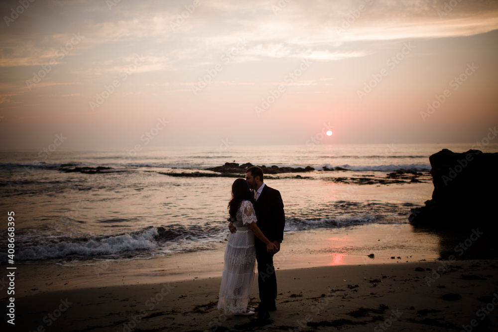 Newlyweds Posing on Beach at Sunset in San Diego Newlyweds Posing on Beach at Sunset in San Diego