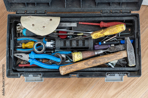 Open tool box with many different tools in it.