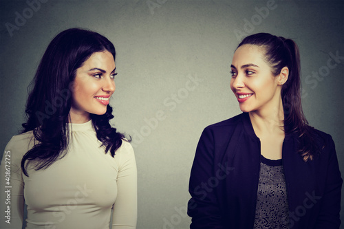 Принти на полотні Portrait of two happy women looking at each other