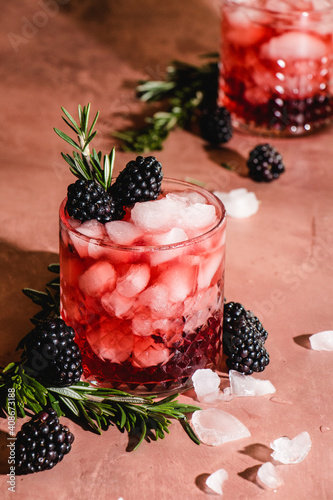 blackberry whiskey cocktail with rosemary garnish