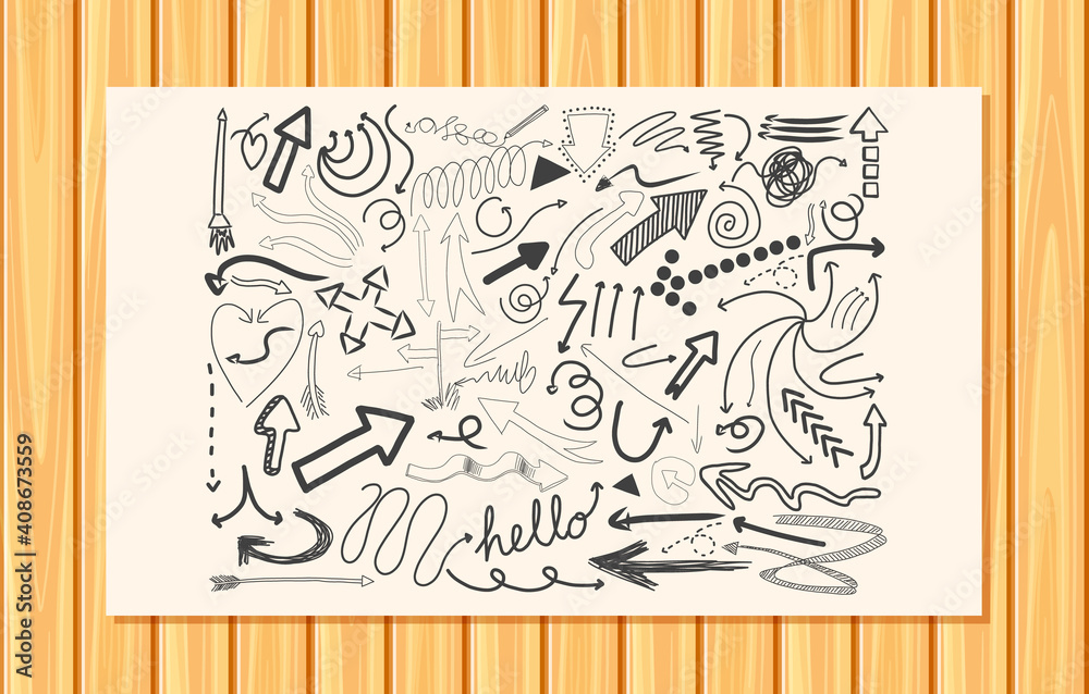 Different doodle strokes on a paper on wooden wall background