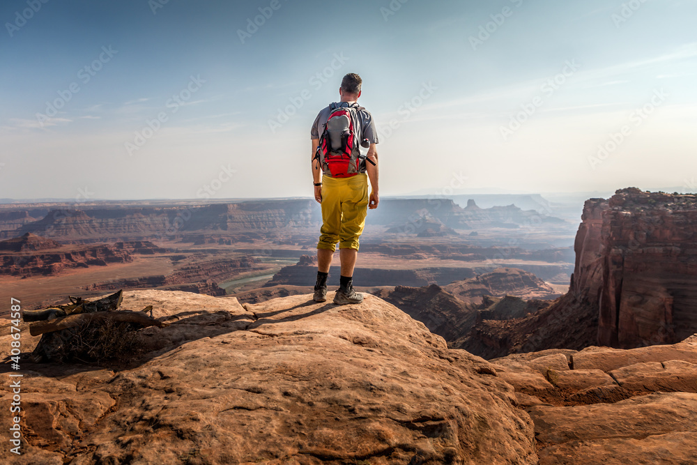Hiker enjoying the view in the Dead Horse Point State Park Hiker enjoying the view in the Dead Horse Point State Park