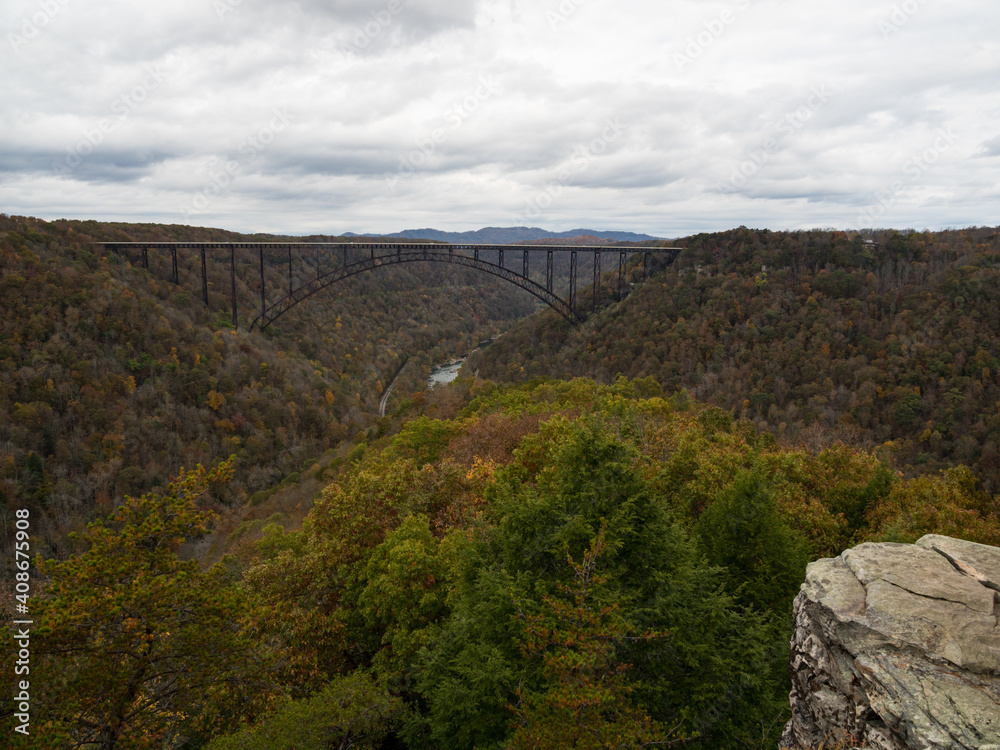 Vista of the river, mountains, and New River Gorge Bridge in the national park in West Virginia.