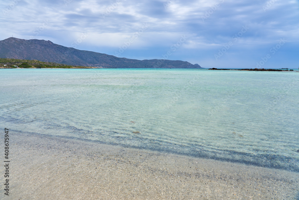 A tropical beach with turquoise water in Crete. A tropical beach with turquoise water in Crete.
