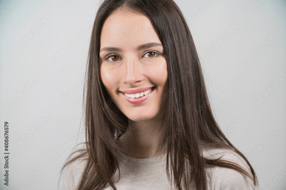 portrait of a young girl smiling on a white background portrait of a young girl smiling on a white background