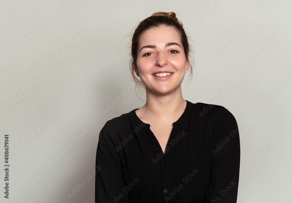Beautiful young woman with a friendly and bright smile being happy Beautiful young woman with a friendly and bright smile being happy