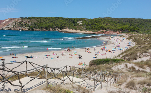 Tourists on the beach at Cala Algaiarens, Menorca, Balearic Islands, Spain photo