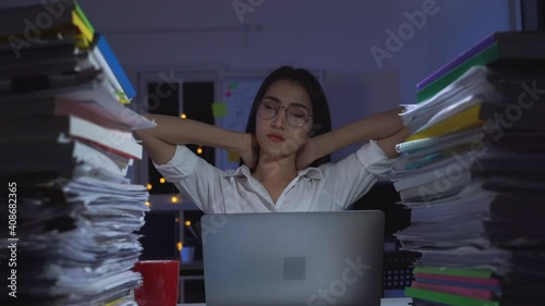 Portrait of asian woman and serious millennial hard working at home pain with office syndrome working from Home overload at night