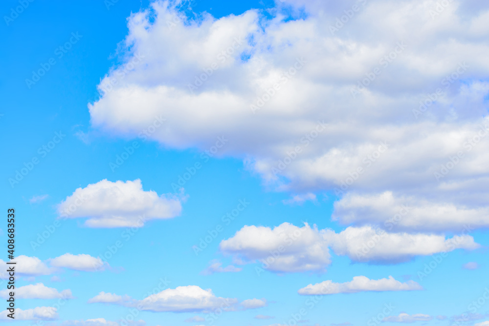 White cumulus clouds in blue sky at daytime. Natural background photo texture White cumulus clouds in blue sky at daytime. Natural background photo texture