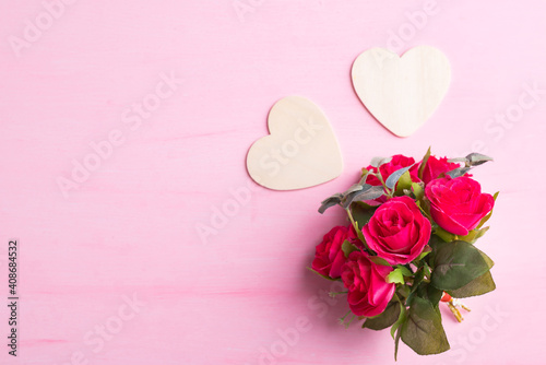 Beautiful red rose flower bouquet with heart shape on pink background  Valentine day