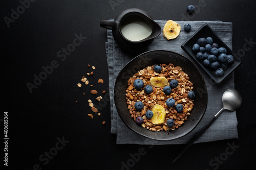 Muesli with berries and fruits in bowl photo