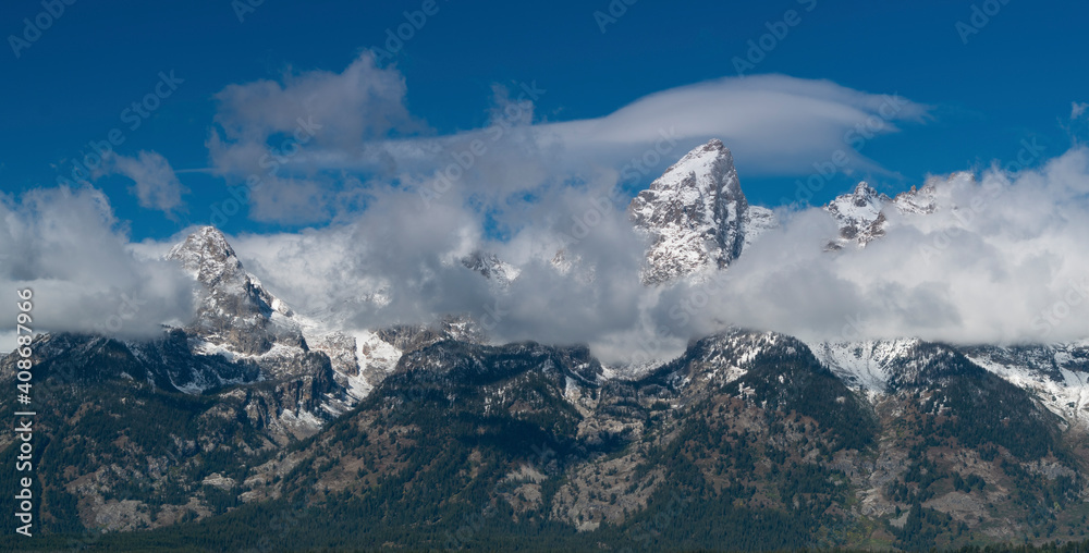 close up of storm clouds clearing from teton mountain range at grand teton national park
