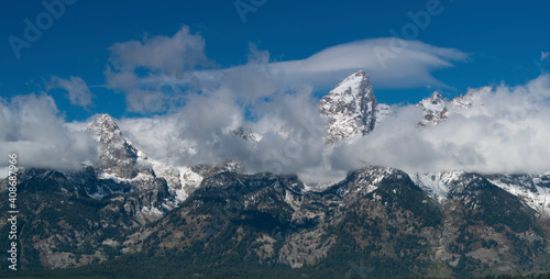 Photos close up of storm clouds clearing from teton mountain range at grand teton natio