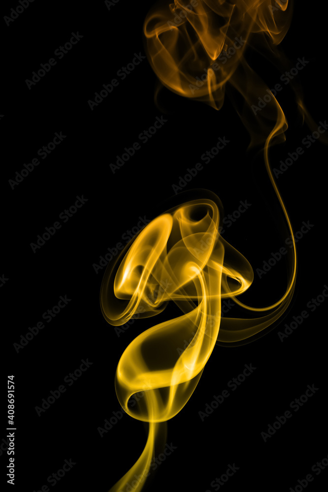 swirling movement of yellow smoke group, abstract line Isolated on black background swirling movement of yellow smoke group, abstract line Isolated on black background