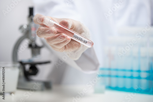 Doctor or vaccinologist working on a vaccine in the laboratory  coronavirus control concept