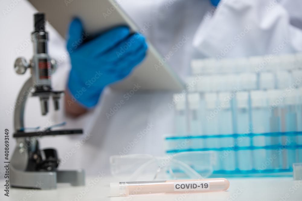 Doctor or vaccinologist working on a vaccine in the laboratory, coronavirus control concept Doctor or vaccinologist working on a vaccine in the laboratory, coronavirus control concept