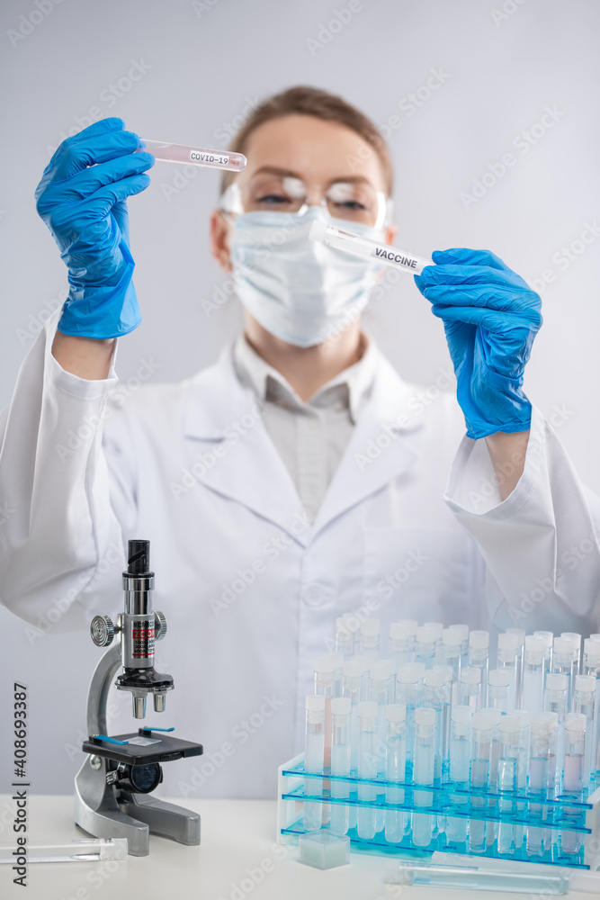 Vaccinologist or doctor in the laboratory inventing the coronavirus vaccine Vaccinologist or doctor in the laboratory inventing the coronavirus vaccine