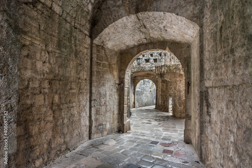 Narrow archway in the ancient streets of Kotor Old Town Montenegro.