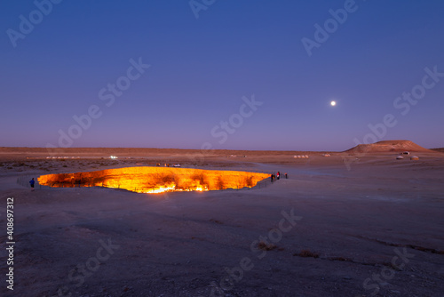 Canvastavla Darvaza Gas Crater in Derweze, Turkmenistan, part of Karakum Desert during twilight