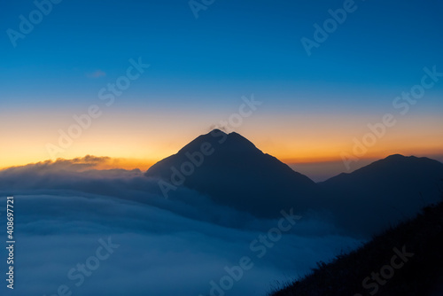 Mountain Fung Wong Shan - Lantau Peak at dusk. Natural landmark in hong kong © leeyiutung