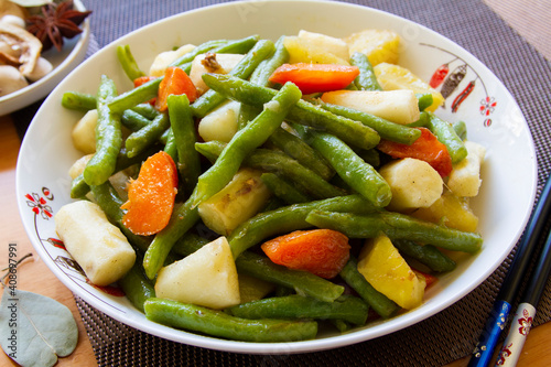 Green beans and potato stir fry close up. Chinese food.